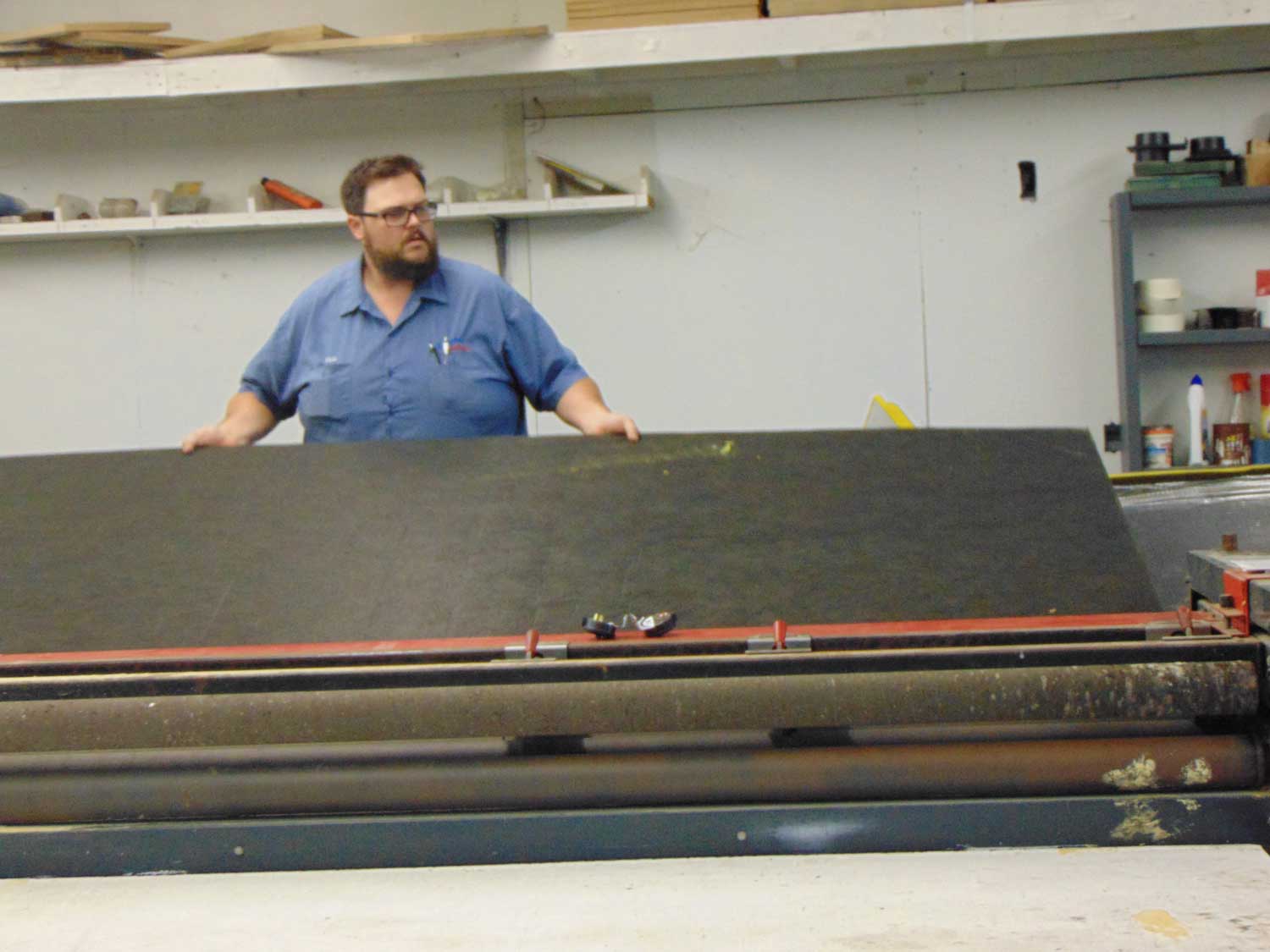 Vaughn's team member working in a shop